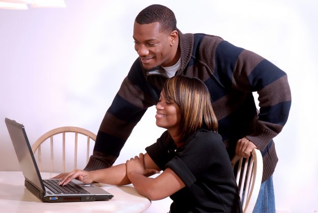 African-american Couple Viewing The Computer